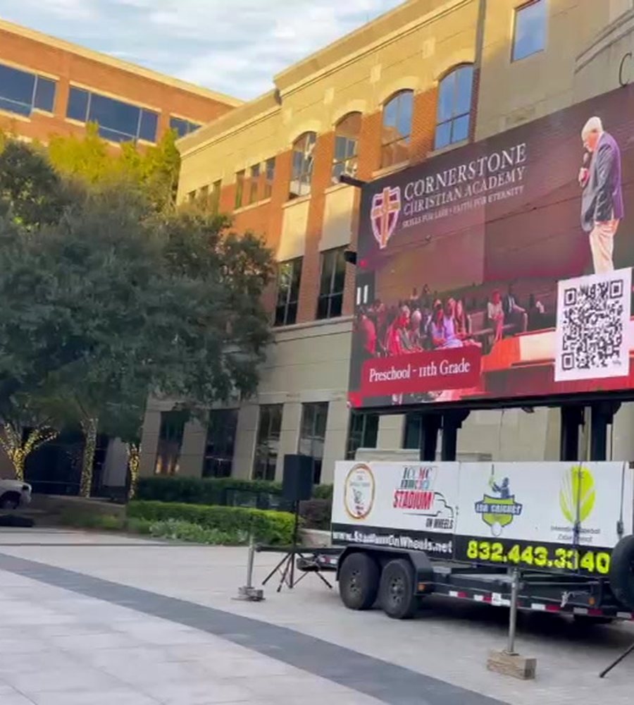 SkyLit Events LED screen trailer at a daytime event